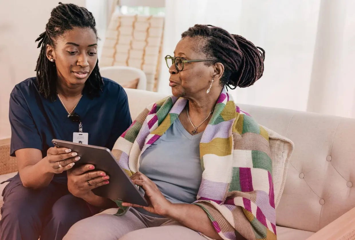 Nurse helping patient sign in