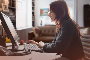 Business professional researching a custom software development company on desktop.